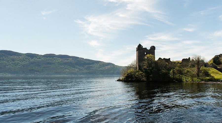 Urquhart Castle rises out of Loch Ness, Inverness, Scotland