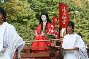 A woman along the procession of the parade for Jidai Matsuri festival