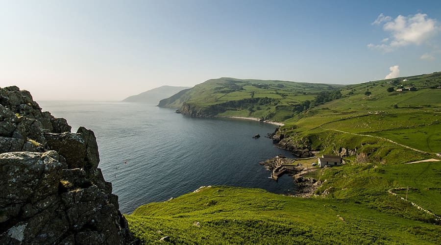 Irish Coastline dotted with farmhouses.