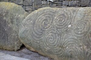 The ancient symbol of the Triskele carved into the stones of Newgrange. A transformative journey