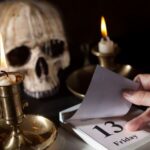 Friday 13th on a calendar with candles and a creepy skull. Myths and Legends, superstition, supernatural