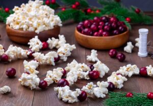 Decorate a woodland tree with a garland of berries and popcorn. legends, ancient mysteries