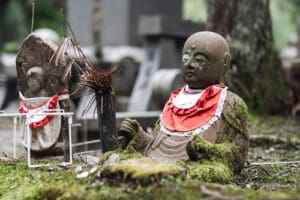 Statues dressed out of respect on Mount Kōya. Spiritual Journey, Transformational Travel, Mysterious Adventure