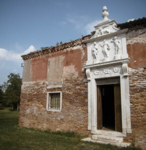 The entrance of a building on Lazzaretto Vecchio, one of the abandoned plague islands of Venice.